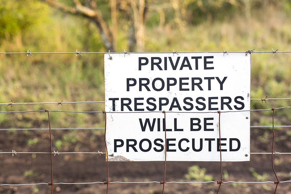 Sinister signs dot the fences, but do little to deter hardened poachers.