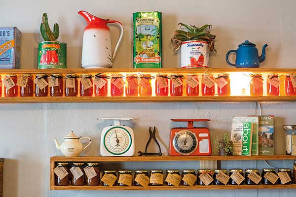Self-harvested honey lines the walls of the Graze Slow Food Cafe