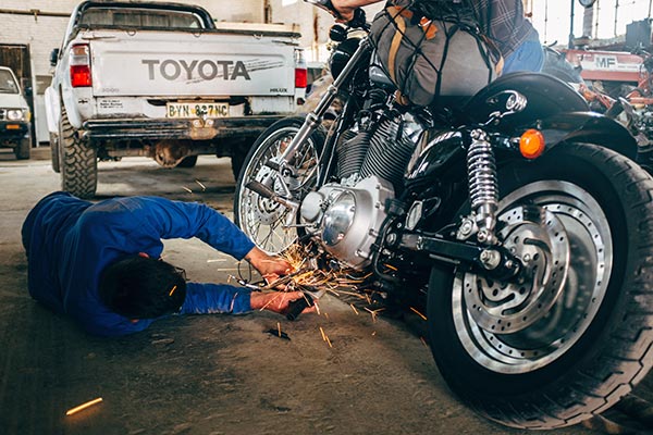 Running repairs to the bike in Carnarvon. Johan opened his workshop outside of hours worked an hour and refused to accept a cent for the repairs