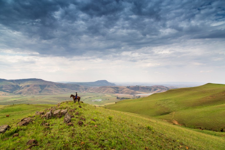 Spha, on his favourite horse, overlooking the lands where he grew up. Photo by Teagan Cunniffe. 