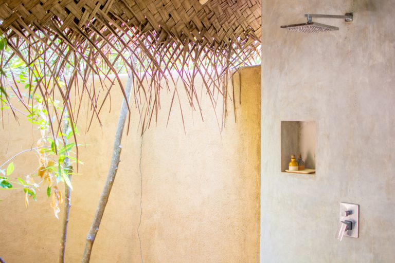 Chic outdoor showers at the treehouse, which is set in a jungle-like environment. 