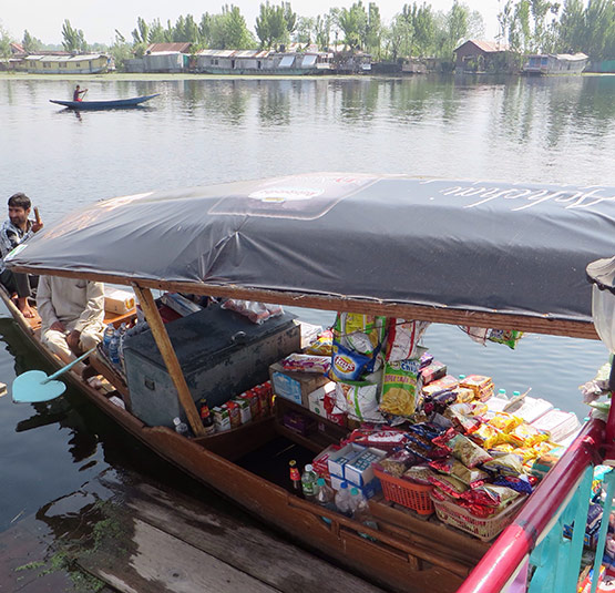 A trader peddling his wares from one of the thousands of shikaras that criss-cross Dal Lake in Kashmirâ€™s Srinagar.
