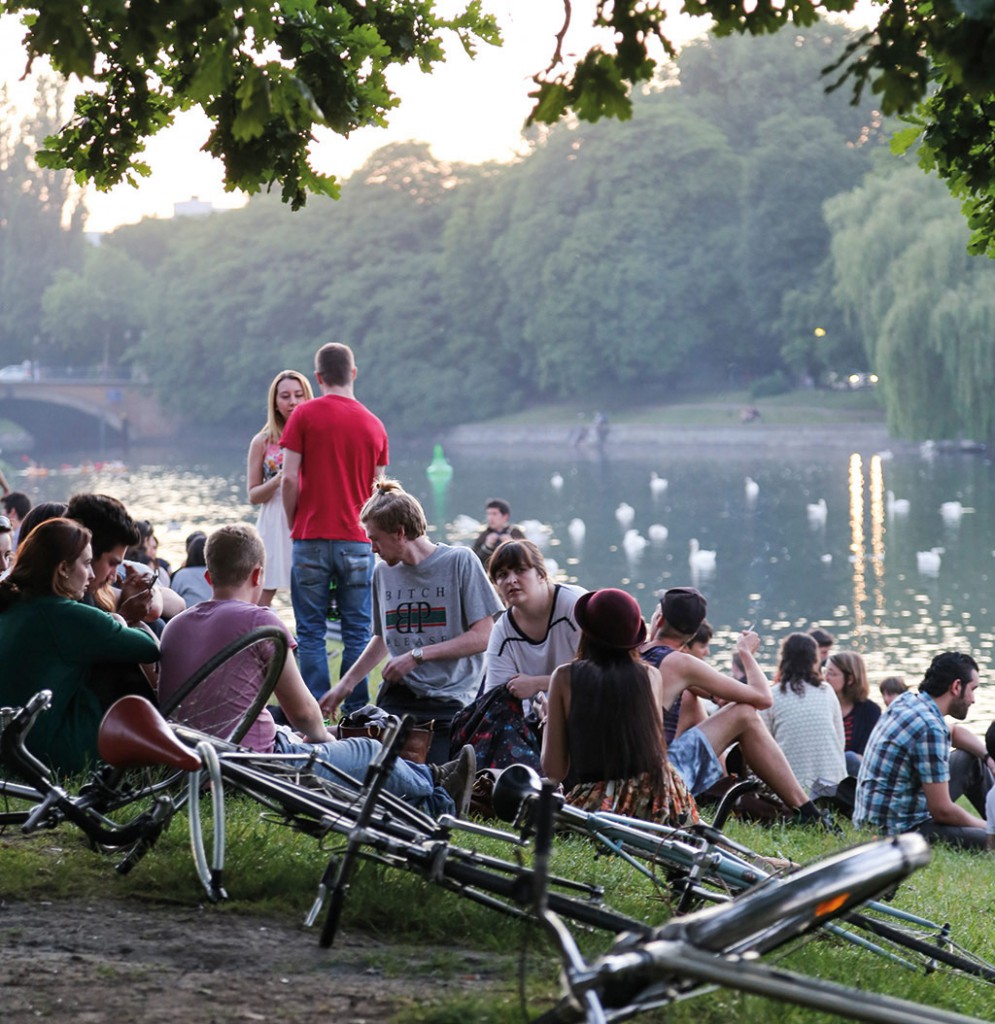 Berliners enjoy a summerâ€™s night on the banks of the Spree.