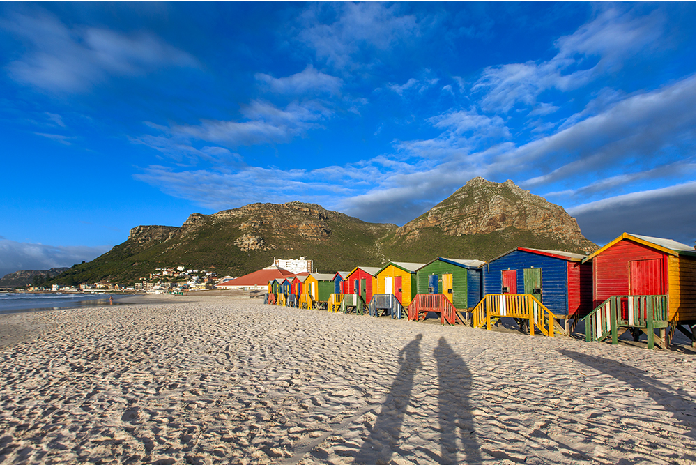 The famous coloured shacks on Muizenberg beach. Image by Teagan Cunniffe.