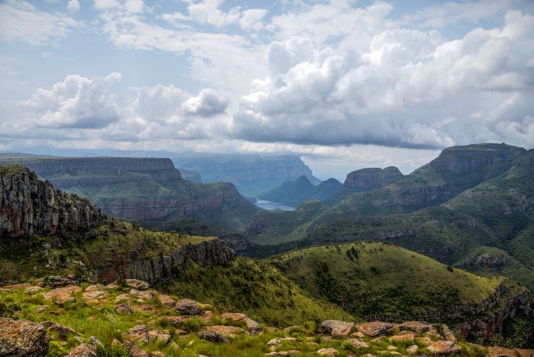 The hills roll and merge with low-hanging clouds at the Lowveld viewing point between Bourkes Luck Potholes and the Three Rondavels on the R532