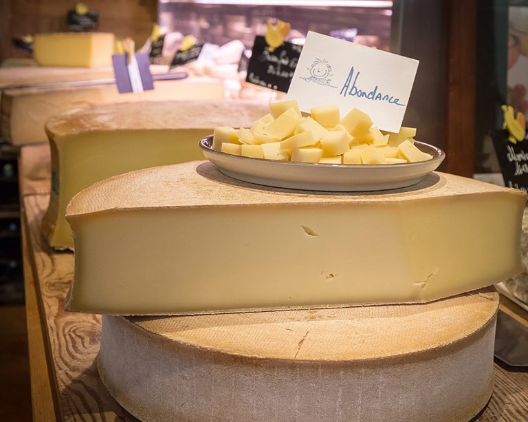 Handcrafted local cheeses are found throughout the Swiss-French border region, such as this Abondance cheese
