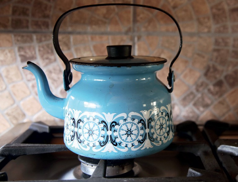 A pot of water boils in Mamma Swartbooi's kitchen in Kayamandi. - Photo by Vuyi Qubeka