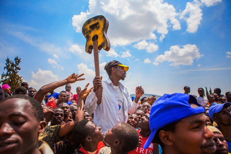 Umuganda, the last Saturday of every month where the community as a whole comes together to clean and build their local districts. I took this image at a small, local rally where President Kagame was speaking. 