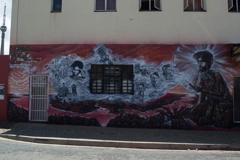Sifiso had said, history very rarely memorialises woman, and the indigenous people. This mural, titled The doors of learning and cultureshall be open, celebrates singing greats like sis Busi Mhlongo and Brenda Fassie.