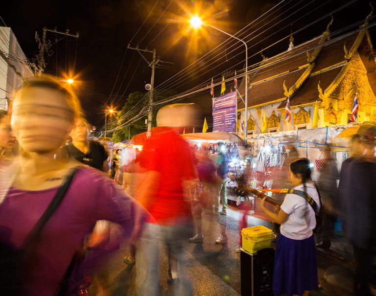 People are strange, when you're a stranger. The bustling streets of Chiang Mai Night Market are a riot of smells, people, and buskers. 