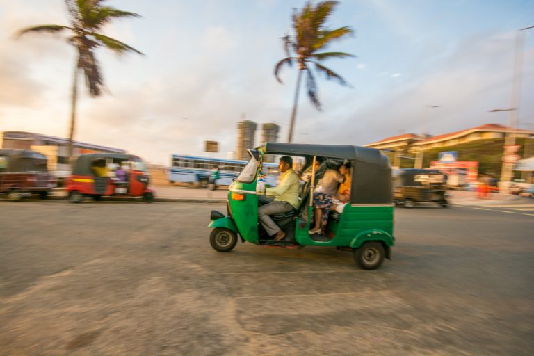 A tuktuk streaking down a road in Colombo, close to the gorgeous Galle Face Green. 