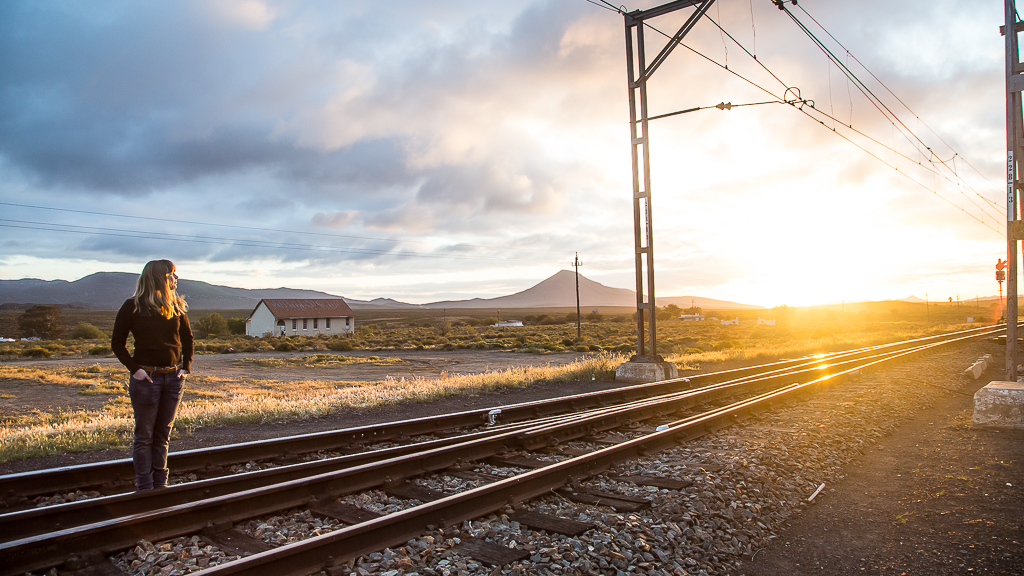 Walking along the railway line in Matjiesfontein at sunrise.