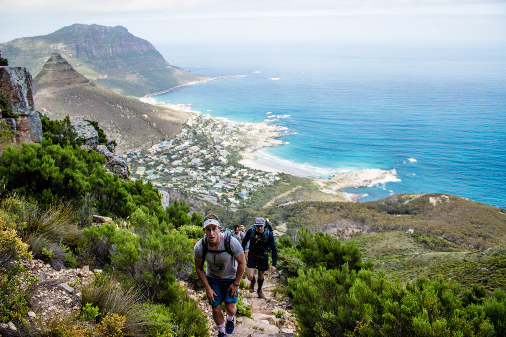The climbing continues on day three, despite the blisters and sore muscles. Llandudno Ravine is one of the many recognised routes up to Table Mountain. In the background is Llandudno, Sandy Bay and Klein Leeukoppie. Photo by Matthew Sterne 