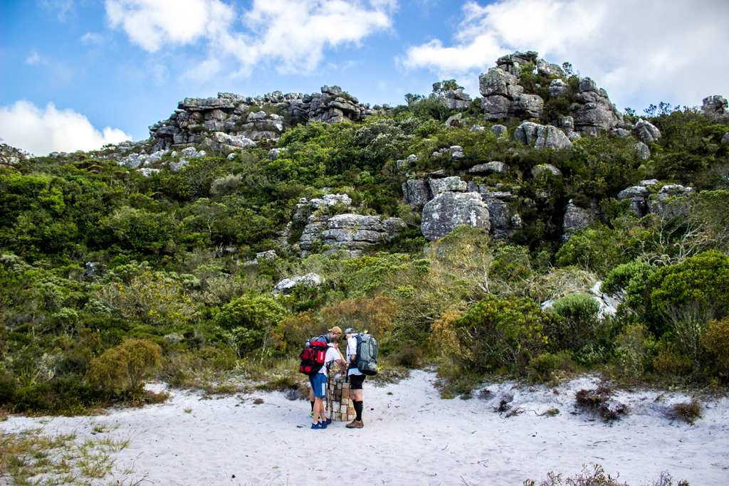 At every major fork in the road there are helpful maps to point you in the right direction. In the Kalk Bay Amphitheatre our group figures out the route to the Silvermine Nature Reserve. Photo by Matthew Sterne 