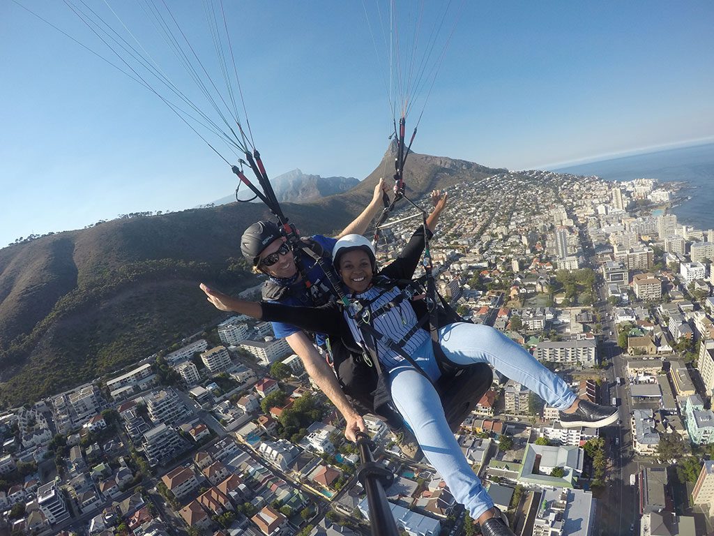 Trusting your instructor is vital, he has your life in his hands. Image by Cape Town Tandem Paraglide.