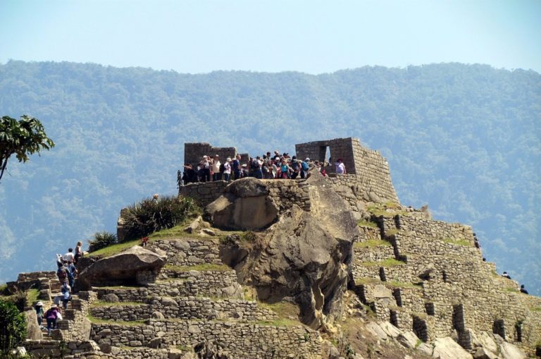 Tourists crowd together to get the best shot of the iconic Machu Picchu peak. Photo: Flickr.