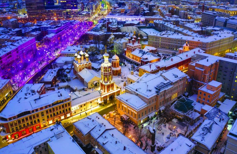 Aerial View Of Illuminated Buildings In City During Winter