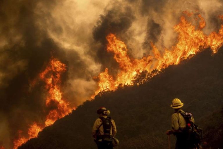 Thousands evacuate as wildfires devastate California