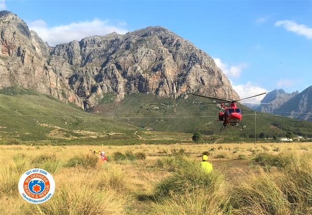 Three hikers suffered broken legs after boulders rolled down on them