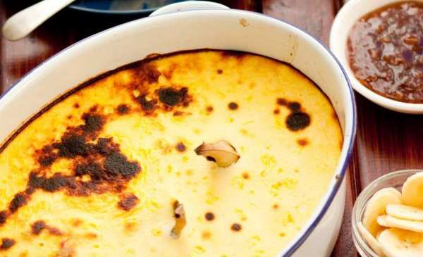 A gold dish of Bobotie - must try food in cape town