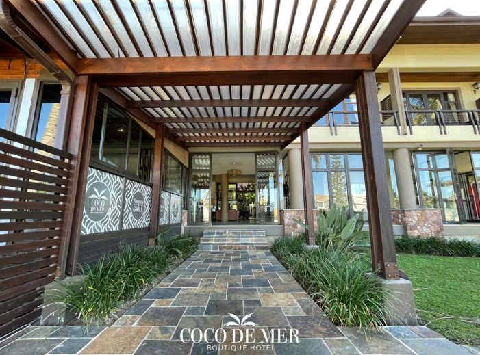 A front entrance view of the Coco De Mer Boutique Hotel 