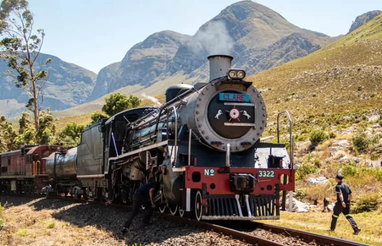 vintage train Cape Town, Mossel Bay Explorer train journey, Garden Route rail travel, scenic Western Cape train ride, heritage railway South Africa, steam train Mossel Bay Great Brak River, vintage observation coach South Africa, Cape Town to Garden Route railway scenery, Western Cape vineyards train view, historic train travel South Africa, Garden Route coastal railway experience, Ceres Rail vintage train, Mossel Bay coastal town South Africa, scenic railway Western Cape mountains, Getaway Magazine