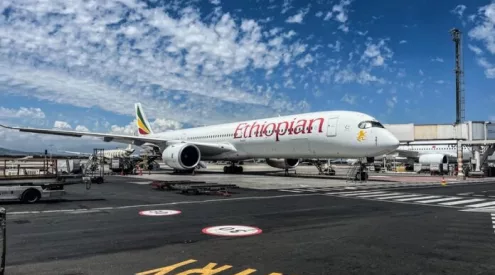 Ethiopian Airlines aircraft Cape Town, Addis Ababa airport hub Africa, Cape Town International Airport runway, Table Mountain aerial view, Cape Winelands vineyards South Africa, African airline cabin interior, business travel Africa flights, Cape Town tourism scenery, Ethiopian Airlines long haul flight, Africa travel connectivity map, Getaway Magazine