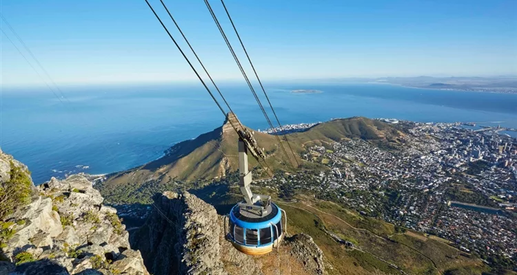 Table Mountain cable car Cape Town, Table Mountain summit views city ocean, Local is Lekker ticket special 2026, Cape Town family outing Table Mountain, aerial cableway rotating cabin, Table Mountain sunset South Africa, Cape Peninsula landmark views, South African travel deal Table Mountain, Easter holiday Cape Town activities, affordable cableway tickets South Africa, Getaway Magazine