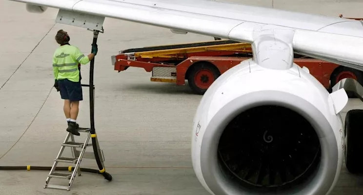 South Africa jet fuel supply, OR Tambo airport aircraft fueling, Cape Town airport runway planes, aviation fuel trucks South Africa, airline operations fuel costs, FlySafair aircraft Johannesburg, Airlink plane South Africa, airport fuel storage tanks, global oil supply routes map, airline passengers boarding South Africa, Getaway Magazine