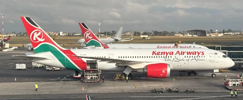 Kenya Airways aircraft Nairobi airport, JetBlue plane JFK airport, Nairobi to New York flight route, Africa to USA travel connection, Kenya Airways cabin passengers, JetBlue domestic US flights, Nairobi airport departures terminal, transatlantic flight Africa America, airline partnership travel routes, Kenya Airways New York route, Getaway Magazine