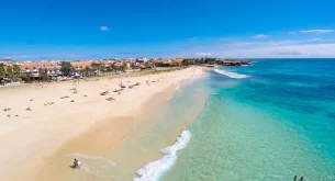 Cabo Verde beach resort, Sal Island Santa Maria coastline, Cabo Verde tourism hotels, African island travel destination, resort dining hygiene travel, tropical holiday Cabo Verde, European tourists beach resort, island food safety travel, Cabo Verde coastline aerial, travel health awareness Africa, Getaway Magazine