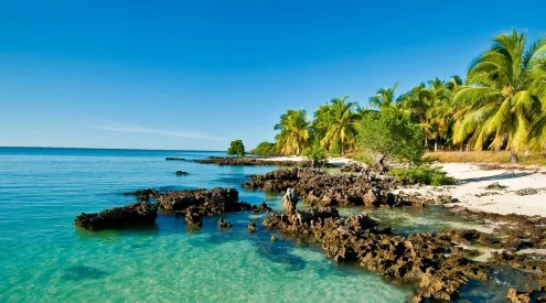 Mozambique beach travel, Mozambique flood recovery, Vilanculos coastline aerial, Bazaruto Archipelago islands, Tofo diving Mozambique, Maputo city coastline, Mozambique road conditions EN1, Indian Ocean Mozambique beaches, Mozambique resorts reopening, Africa coastal tourism recovery, Getaway Magazine