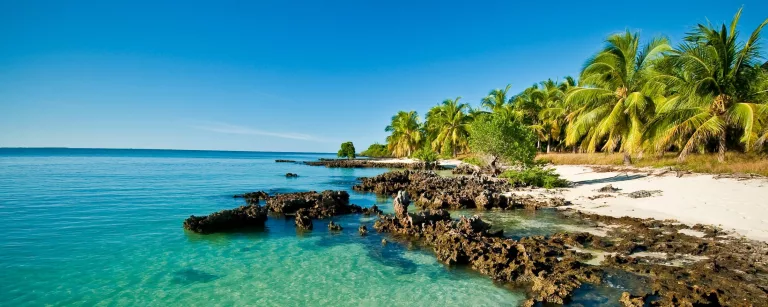 Mozambique beach travel, Mozambique flood recovery, Vilanculos coastline aerial, Bazaruto Archipelago islands, Tofo diving Mozambique, Maputo city coastline, Mozambique road conditions EN1, Indian Ocean Mozambique beaches, Mozambique resorts reopening, Africa coastal tourism recovery, Getaway Magazine