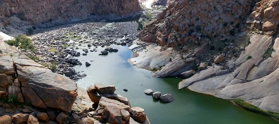 Augrabies Falls waterfall gorge, Orange River canyon Northern Cape, Augrabies national park viewpoints, quiver trees desert landscape South Africa, Kakamas fuel station travel stop, Upington road trip fuel planning, Augrabies self drive safari routes, Northern Cape remote travel scenery, Augrabies sunset gorge views, South Africa desert national parks, Getaway Magazine